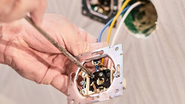 Electrician fixing wires with precision and expertise